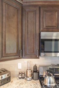 Wood cabinets and marble countertop 