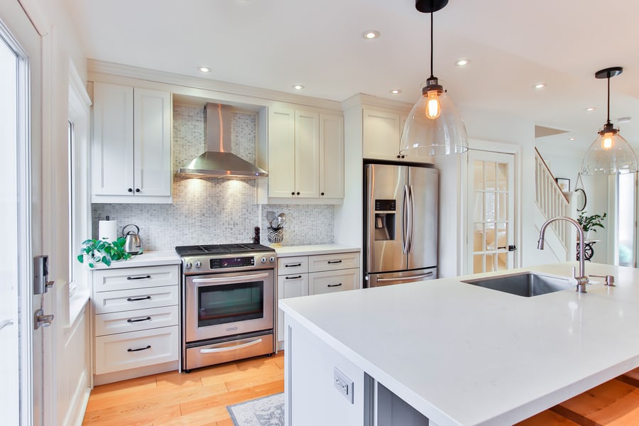 White kitchen with stainless steel appliances